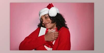 Happy Woman in Santa Hat Holding Present Merry Christmas Concept (Videohive 47712440)